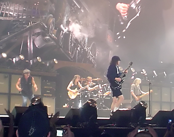 AC/DC performing live in Tacoma, Washington, in 2009, with Brian Johnson, Malcolm Young, Angus Young and Cliff Williams on stage