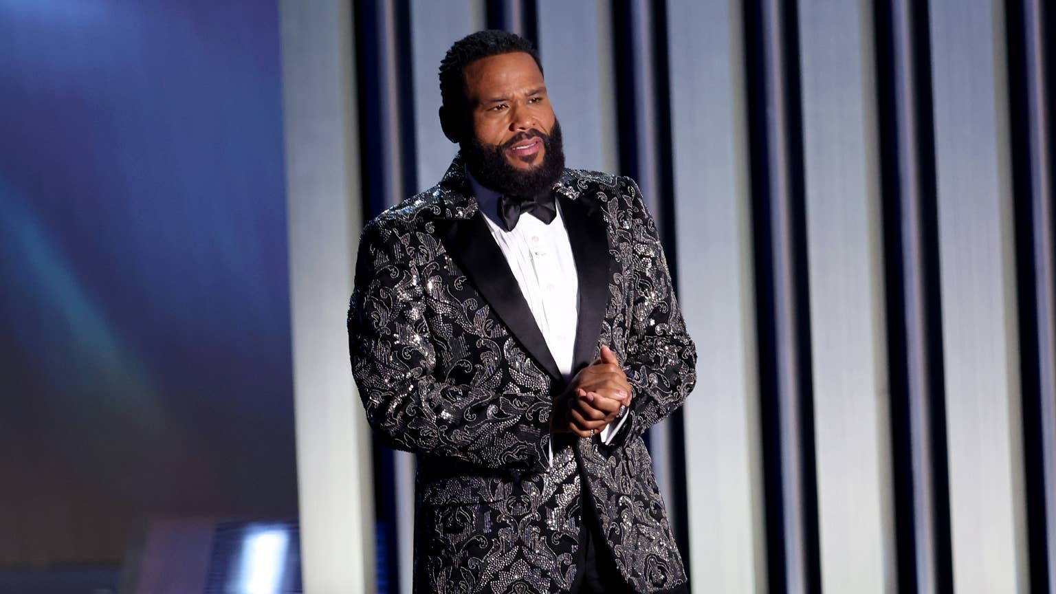 Anthony Anderson in a sparkling tuxedo on stage at the 75th Primetime Emmy Awards