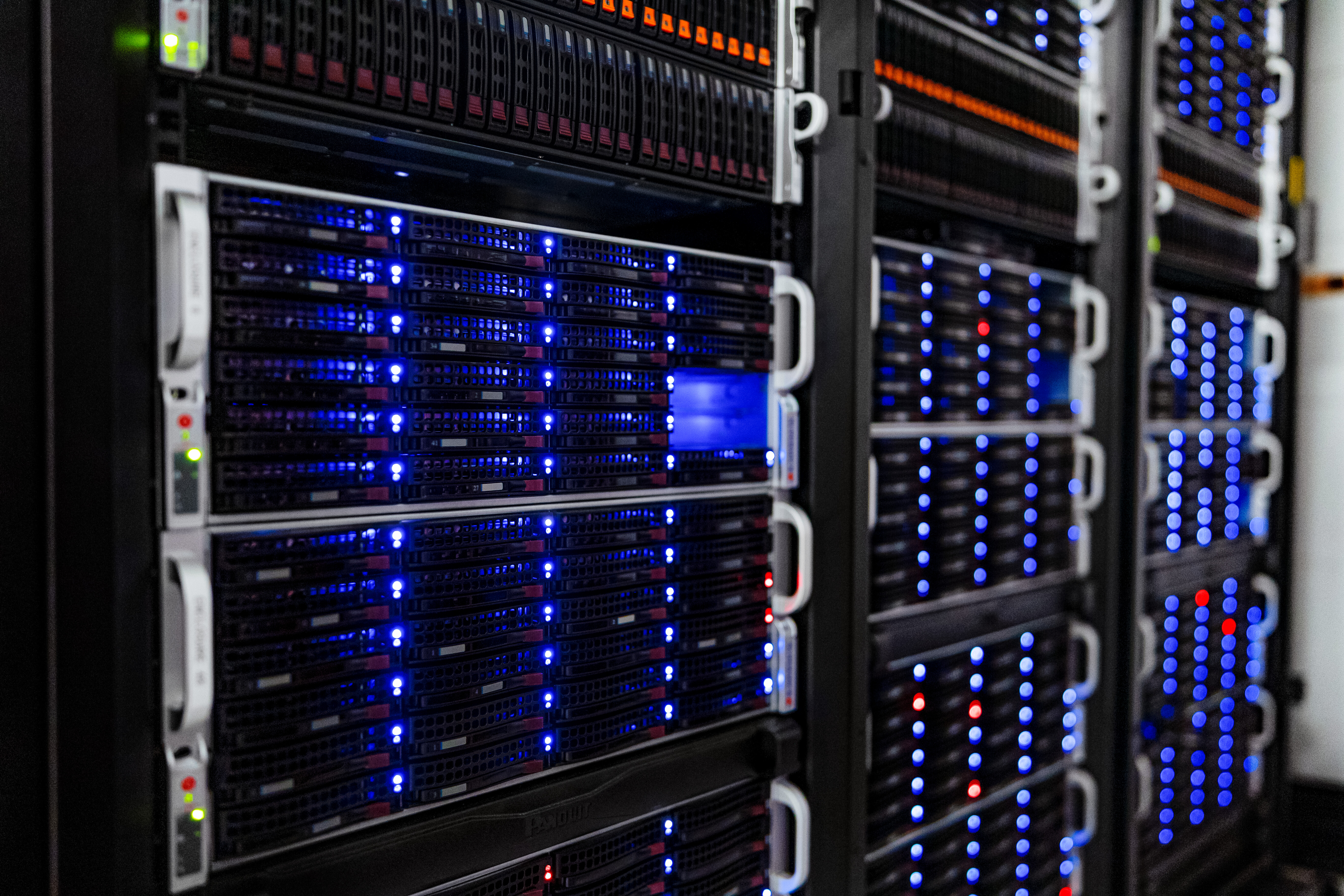 Rows of server racks inside the NOIRLab Headquarters computer server room in Tucson, Arizona