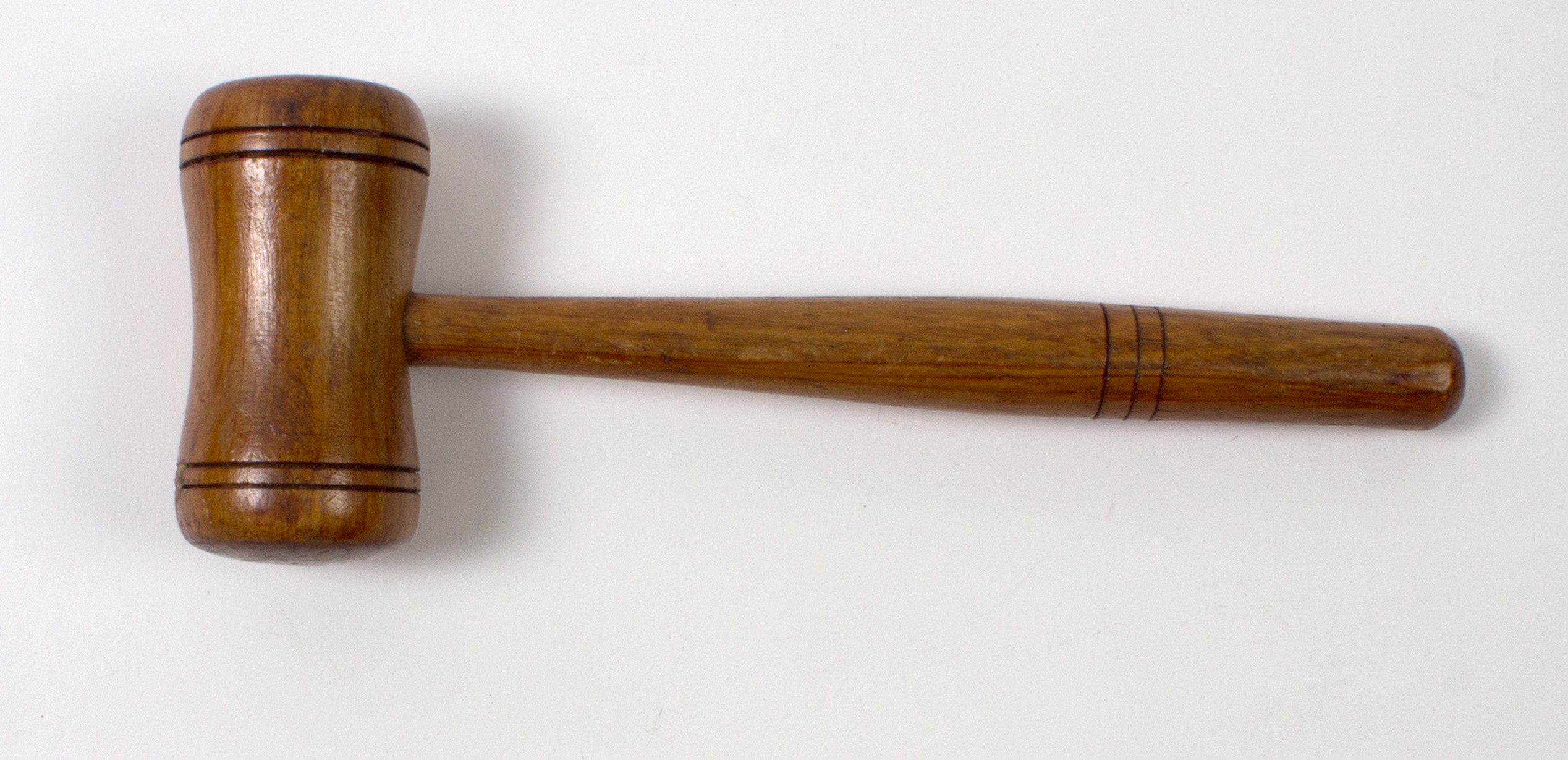 A wooden gavel in a museum collection