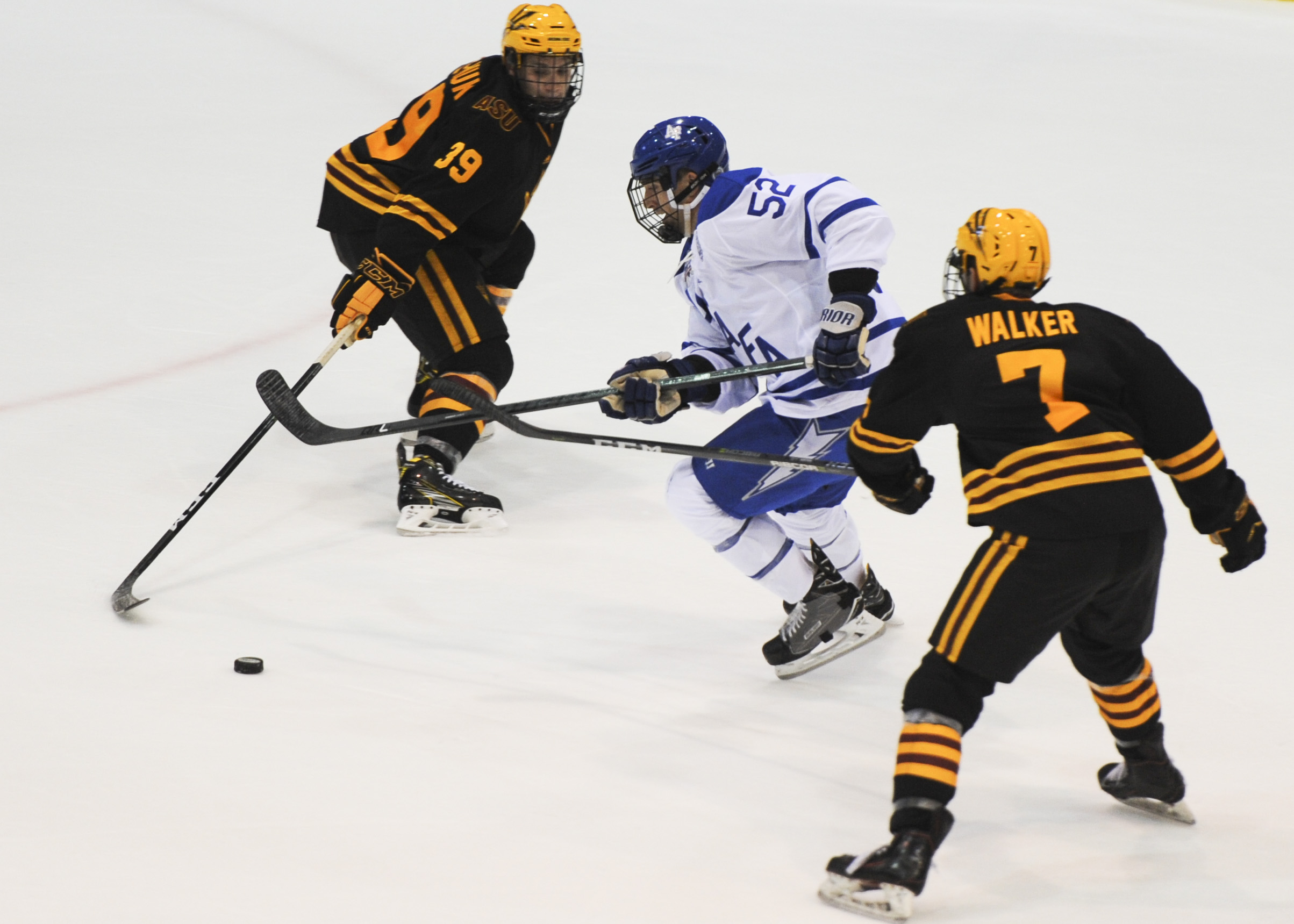 Arizona State Sun Devils hockey players battling Air Force on the ice