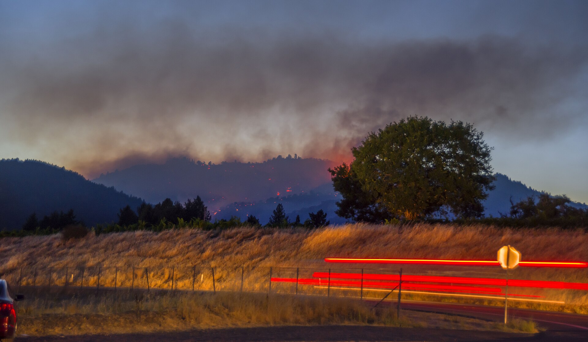 A wildfire burning in California brush country