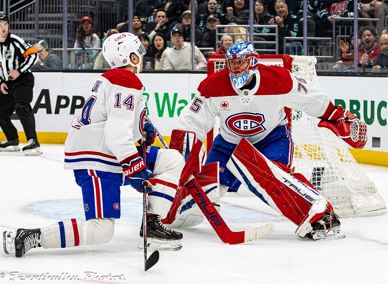 Nick Suzuki and Jakub Dobes of the Montreal Canadiens (file photo, Wikimedia Commons)