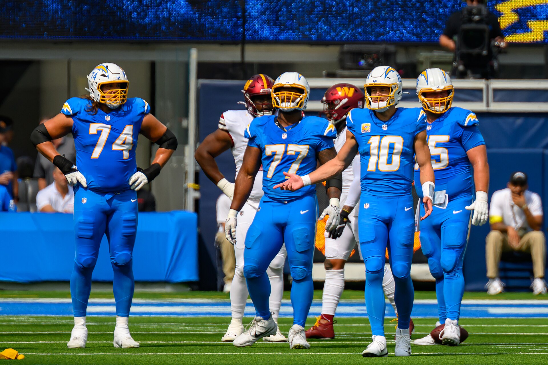 Justin Herbert behind the Los Angeles Chargers offensive line