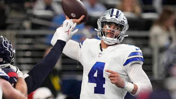 Cowboys quarterback Dak Prescott (4) being hit as he throws against the Texans.