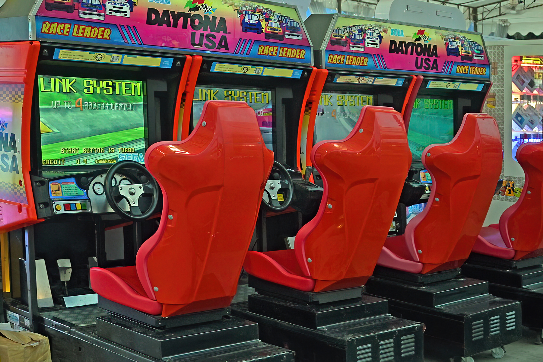 An arcade interior with rows of classic cabinets