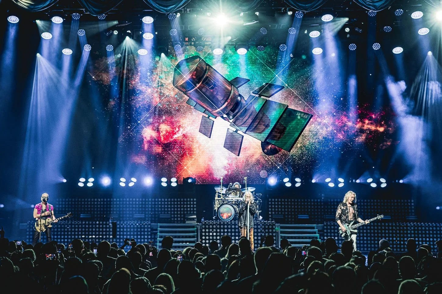 Def Leppard performing live on stage — the band announced a 45-date 2027 North American arena tour on October 8, 2026.