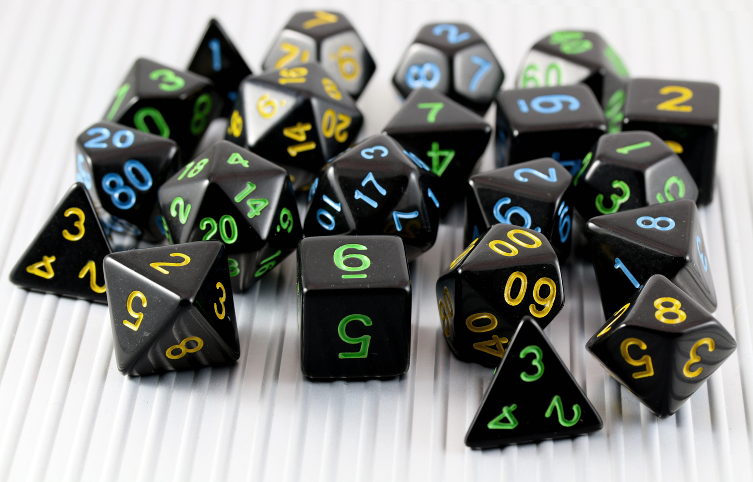 Black polyhedral game dice of the kind used for Dungeons and Dragons