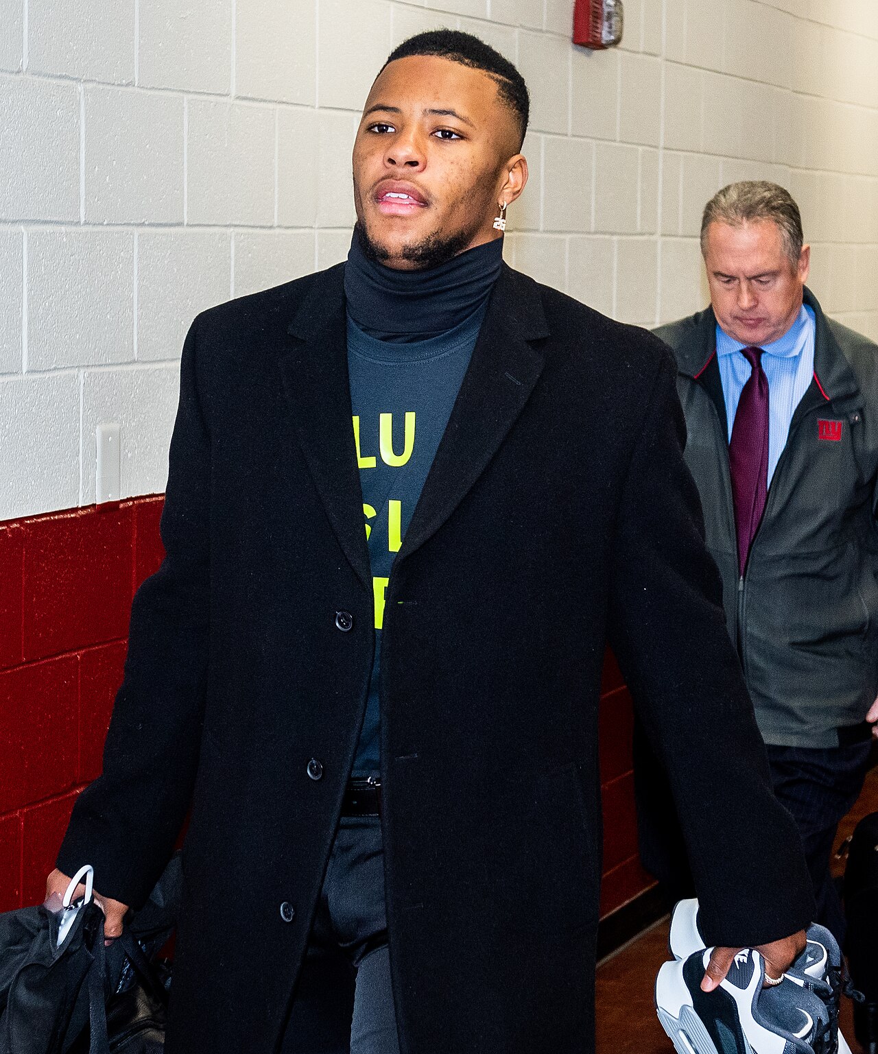 Saquon Barkley walking through a stadium tunnel