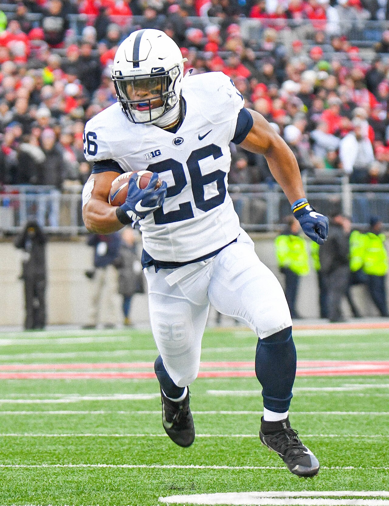 Saquon Barkley running with the football