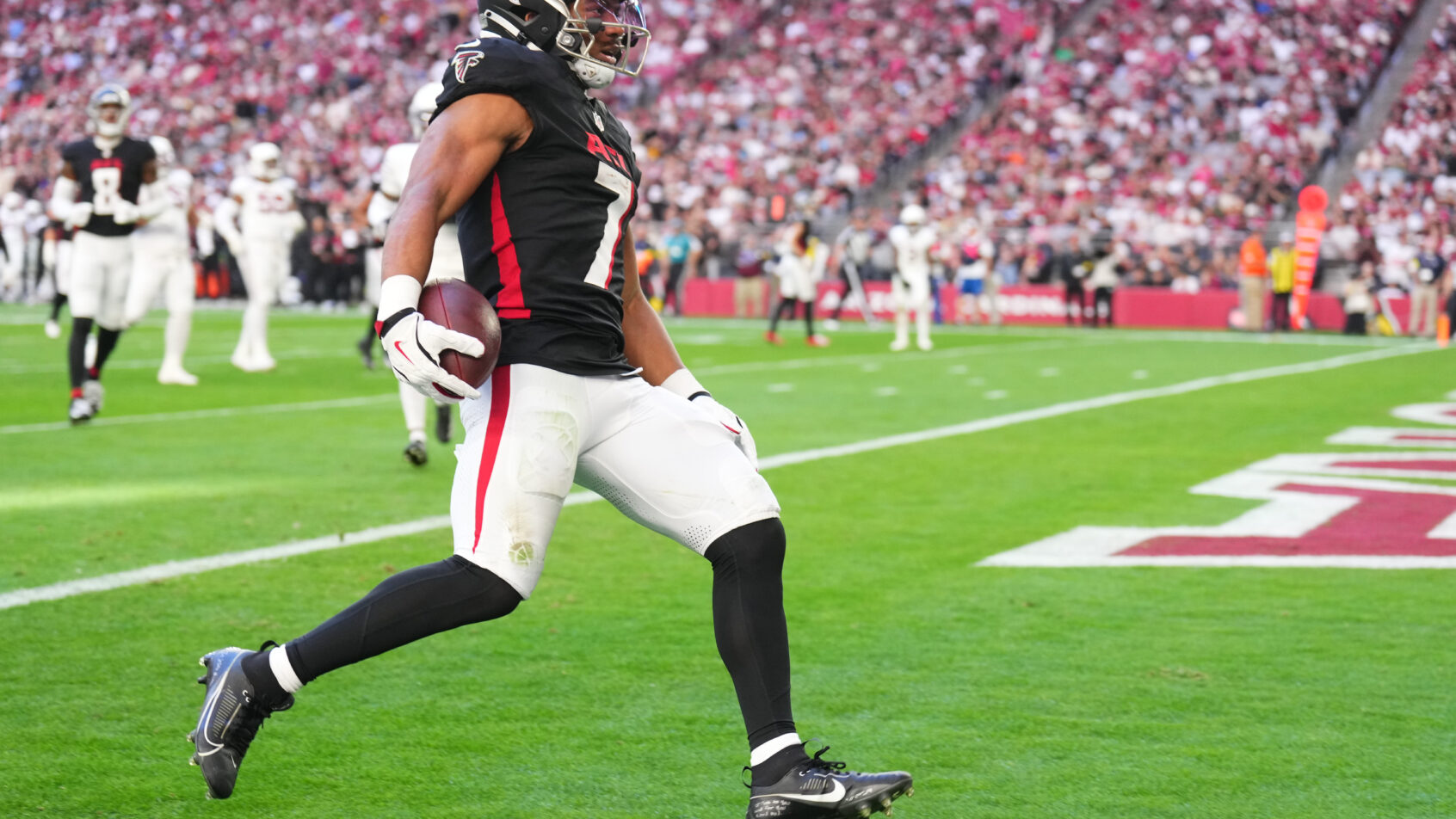 Atlanta Falcons running back Bijan Robinson breaks free for a long touchdown run during Monday Night Football