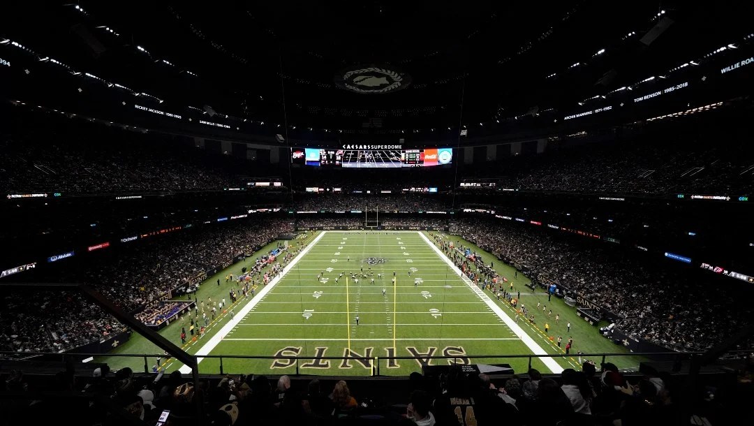 The Caesars Superdome in New Orleans lit up at night