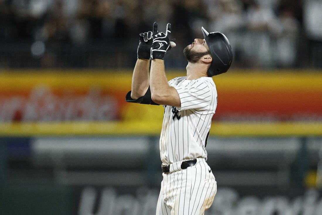 A Chicago White Sox player celebrates a home run.