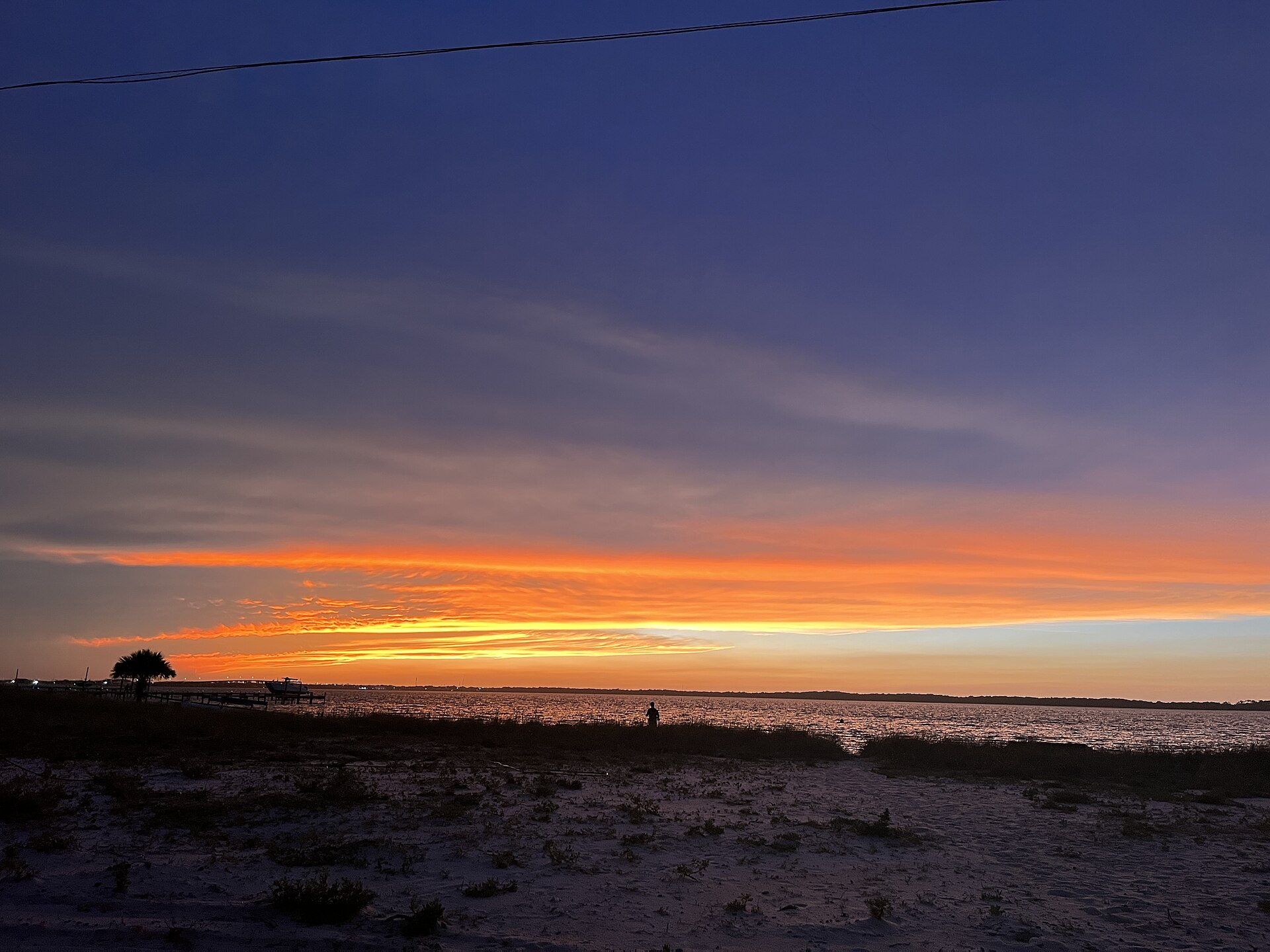 Sunset over Pensacola Beach, Florida — the coastline bracing for Hurricane Isaias on Friday