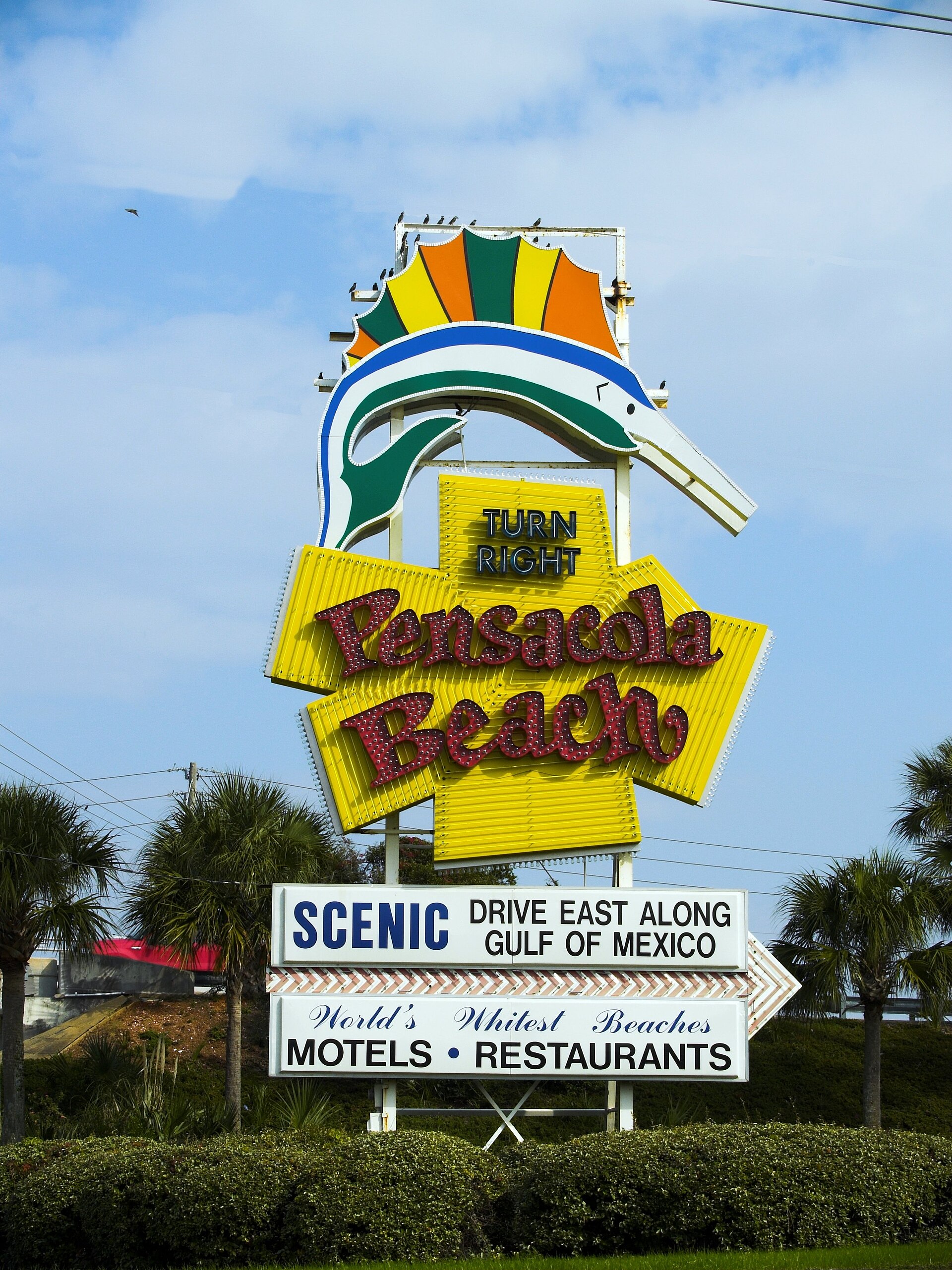 The Pensacola Beach sign — residents under evacuation orders were urged to leave Friday as Isaias closed in