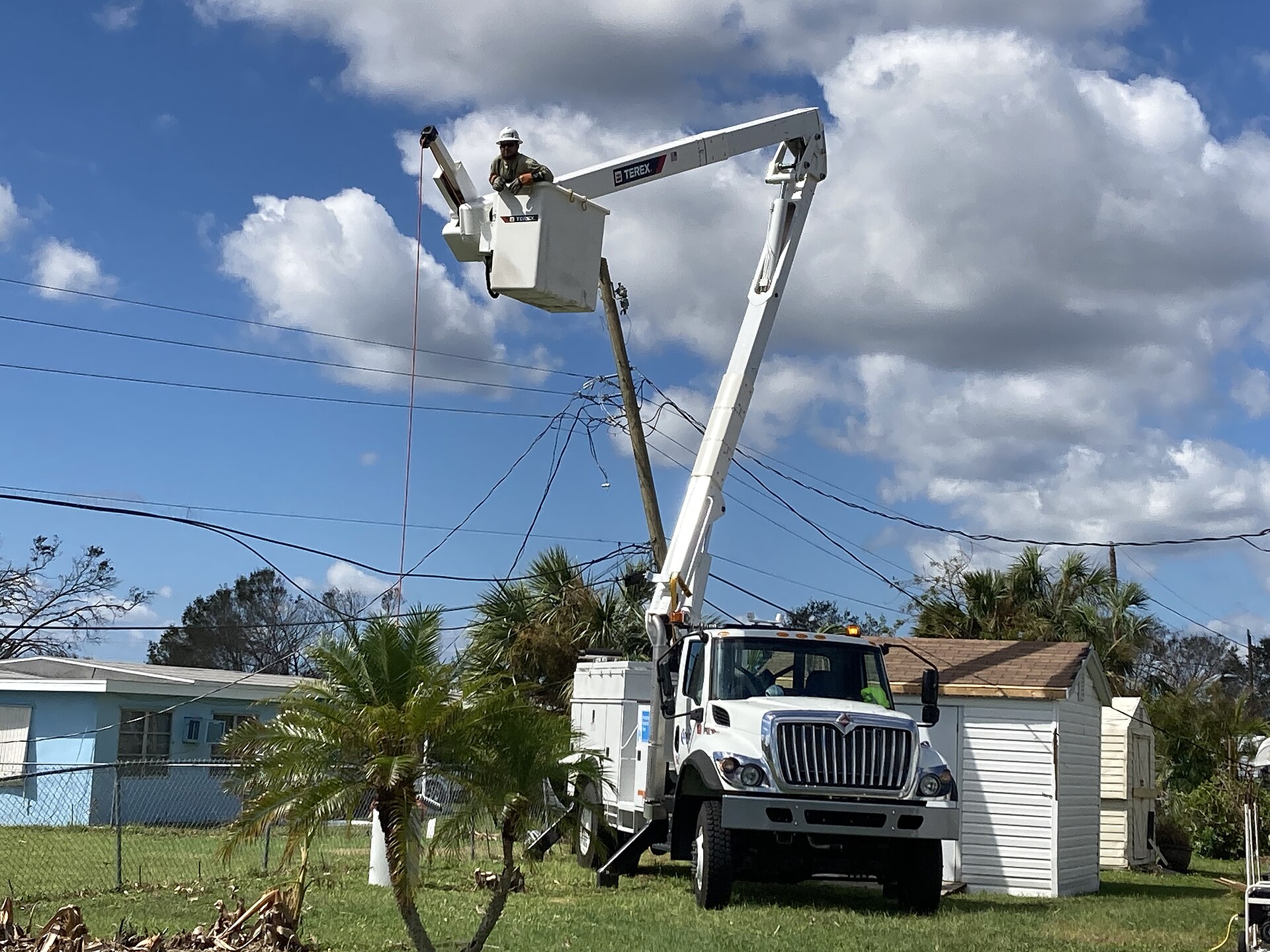 Utility crews restoring power after a hurricane in Florida