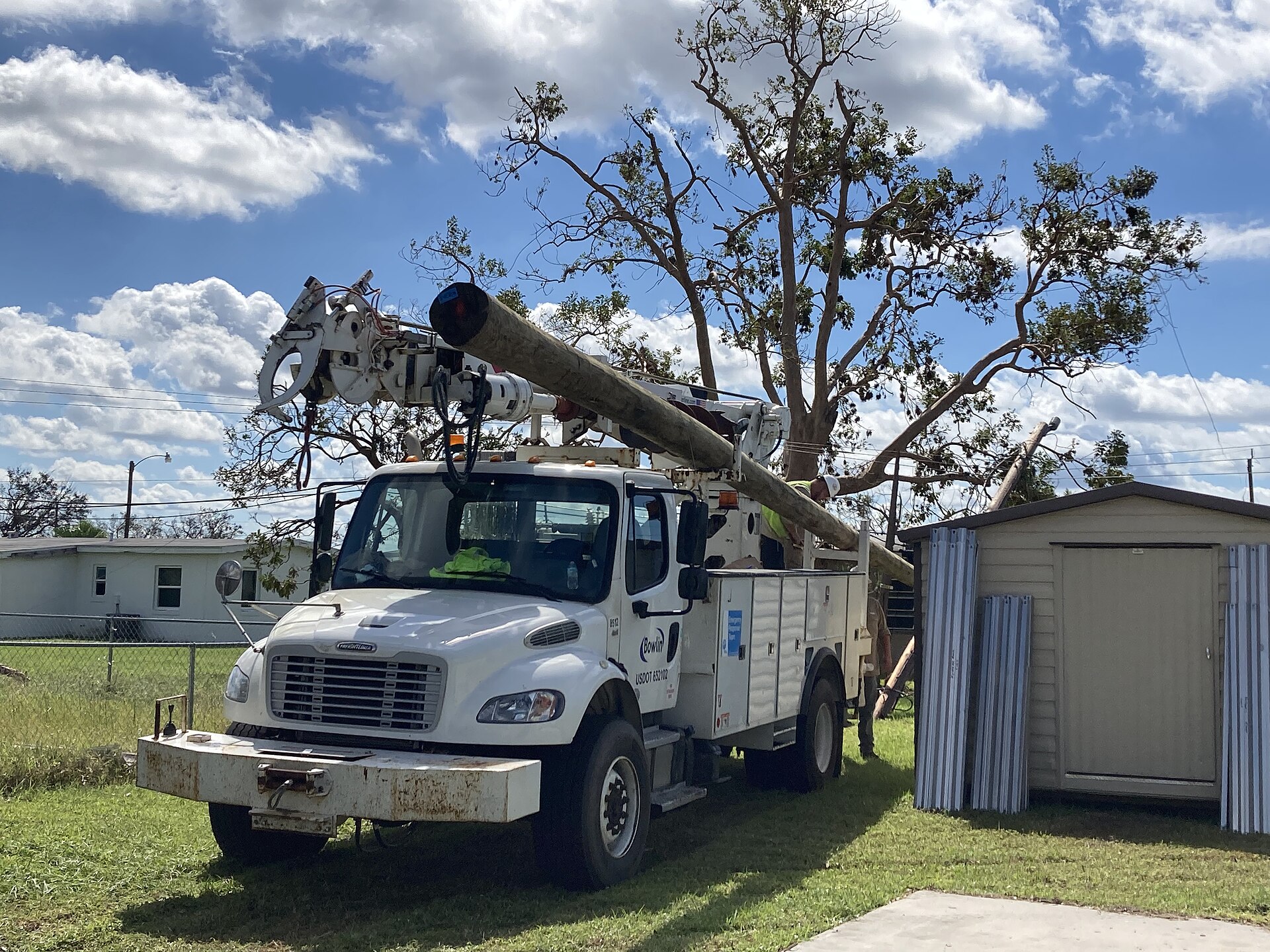 Utility crew members working on power restoration in Florida