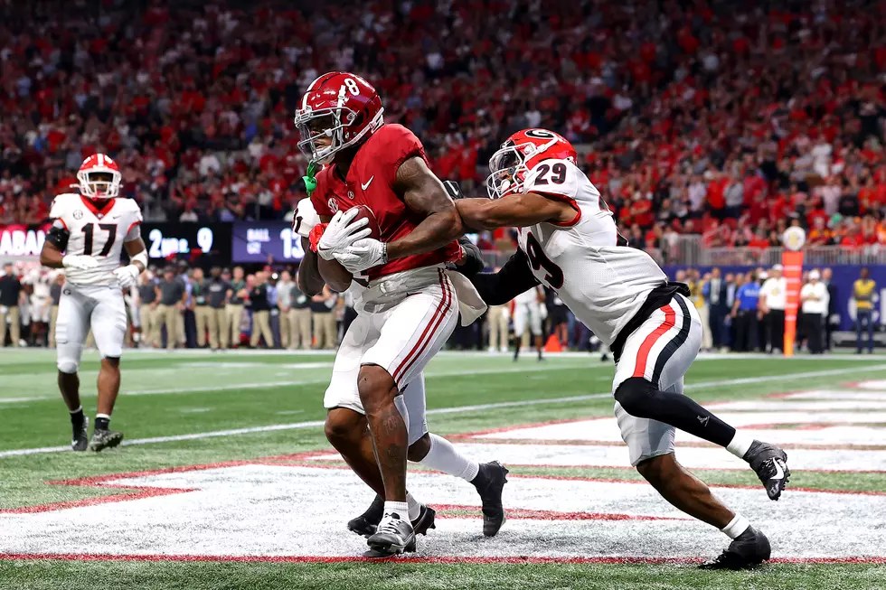 Alabama and Georgia players in game action during a college football game