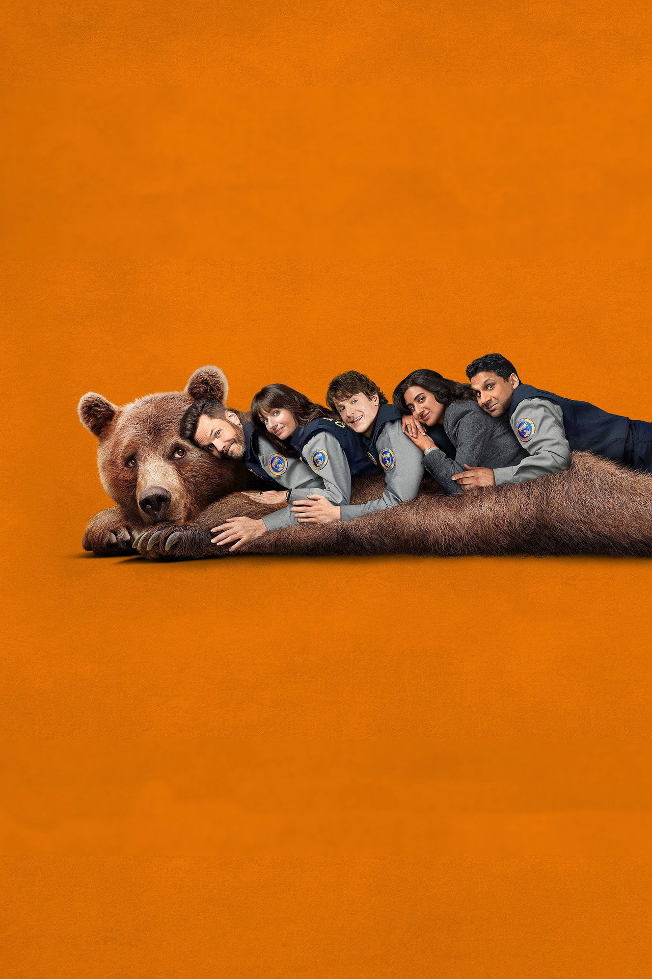I Kill the Bear official poster — the cast poses with a bear