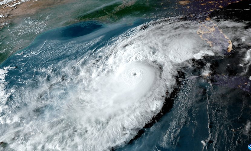 NOAA GOES-16 satellite imagery of a hurricane churning in the Gulf of Mexico, with the Florida peninsula visible at right