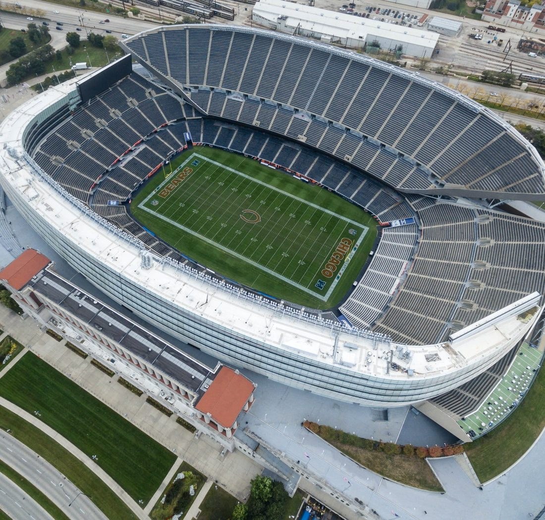 Soldier Field from above on a clear day, with BEARS and CHICAGO painted in the end zones ahead of the Jets vs. Bears Week 4 game.