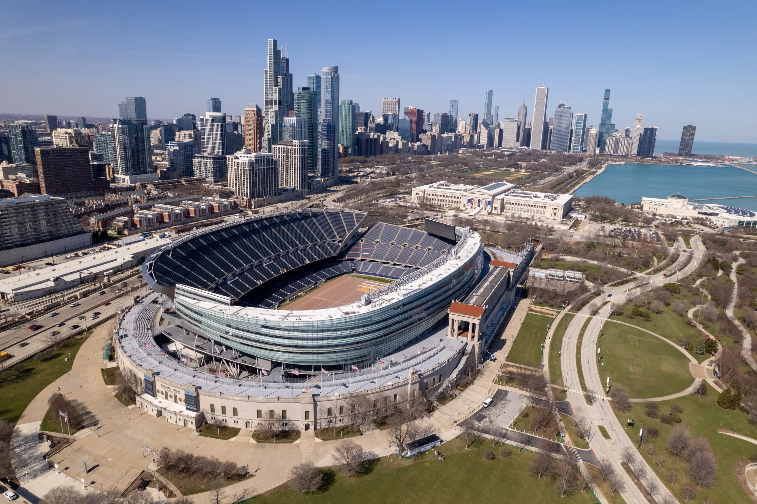 Soldier Field with the downtown Chicago skyline on a clear day.
