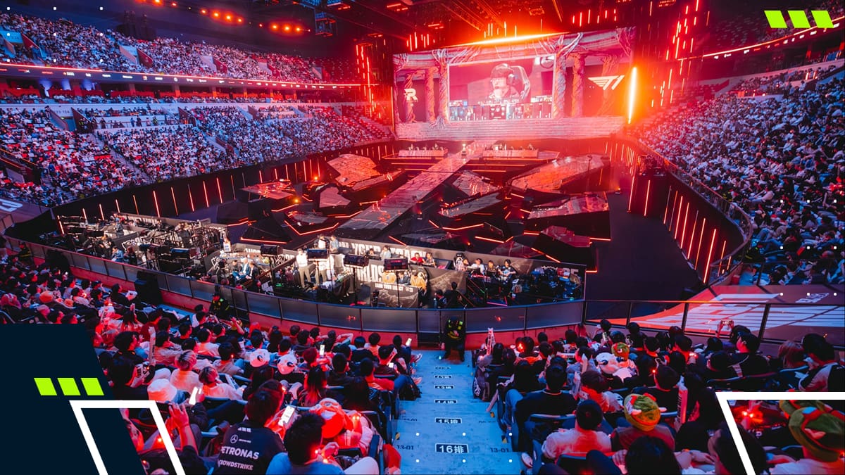 A packed esports arena during a League of Legends championship match, with the main stage lit up before thousands of fans