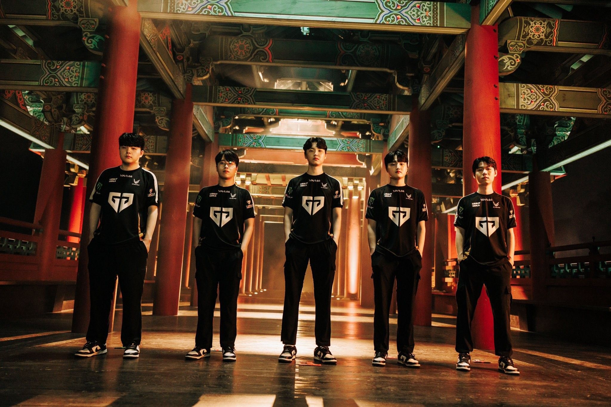 The Gen.G League of Legends roster posing in team jerseys at a Korean temple