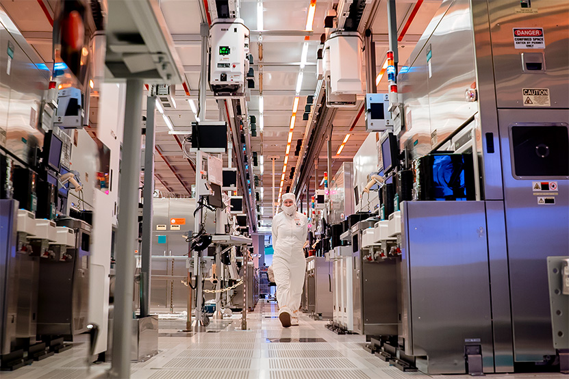 A worker walks through a chip fabrication cleanroom (file photo)