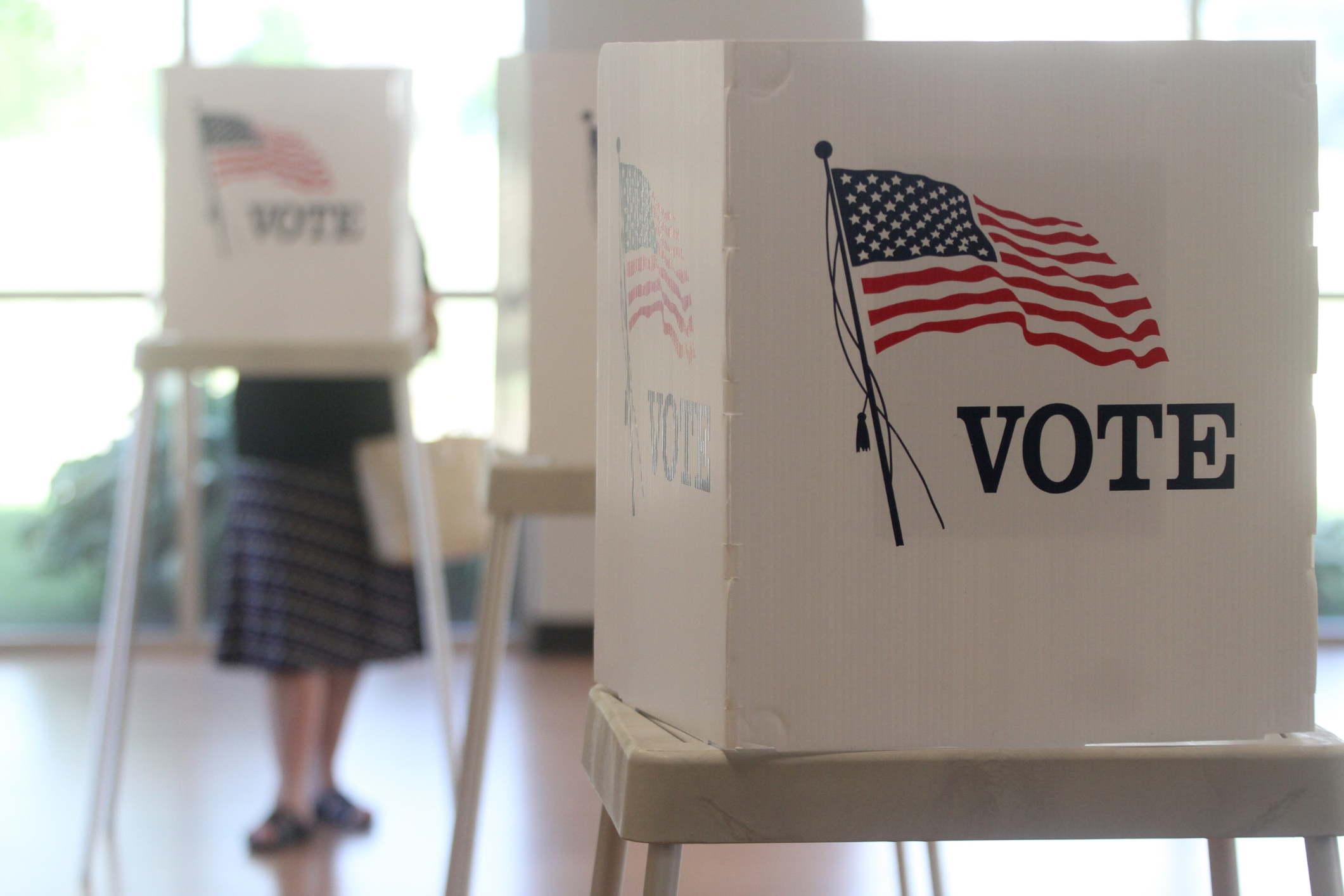 An 'I Voted' sticker on a bright background