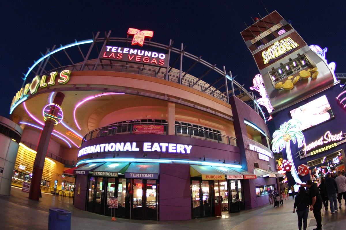 Neonopolis at night on Fremont Street, with the SlotZilla attraction tower beside it
