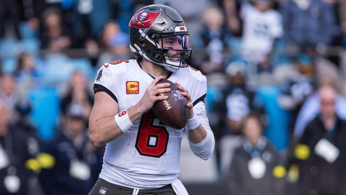 Tampa Bay Buccaneers quarterback Baker Mayfield (6), wearing the captain's C patch, sets to throw in the white away uniform.