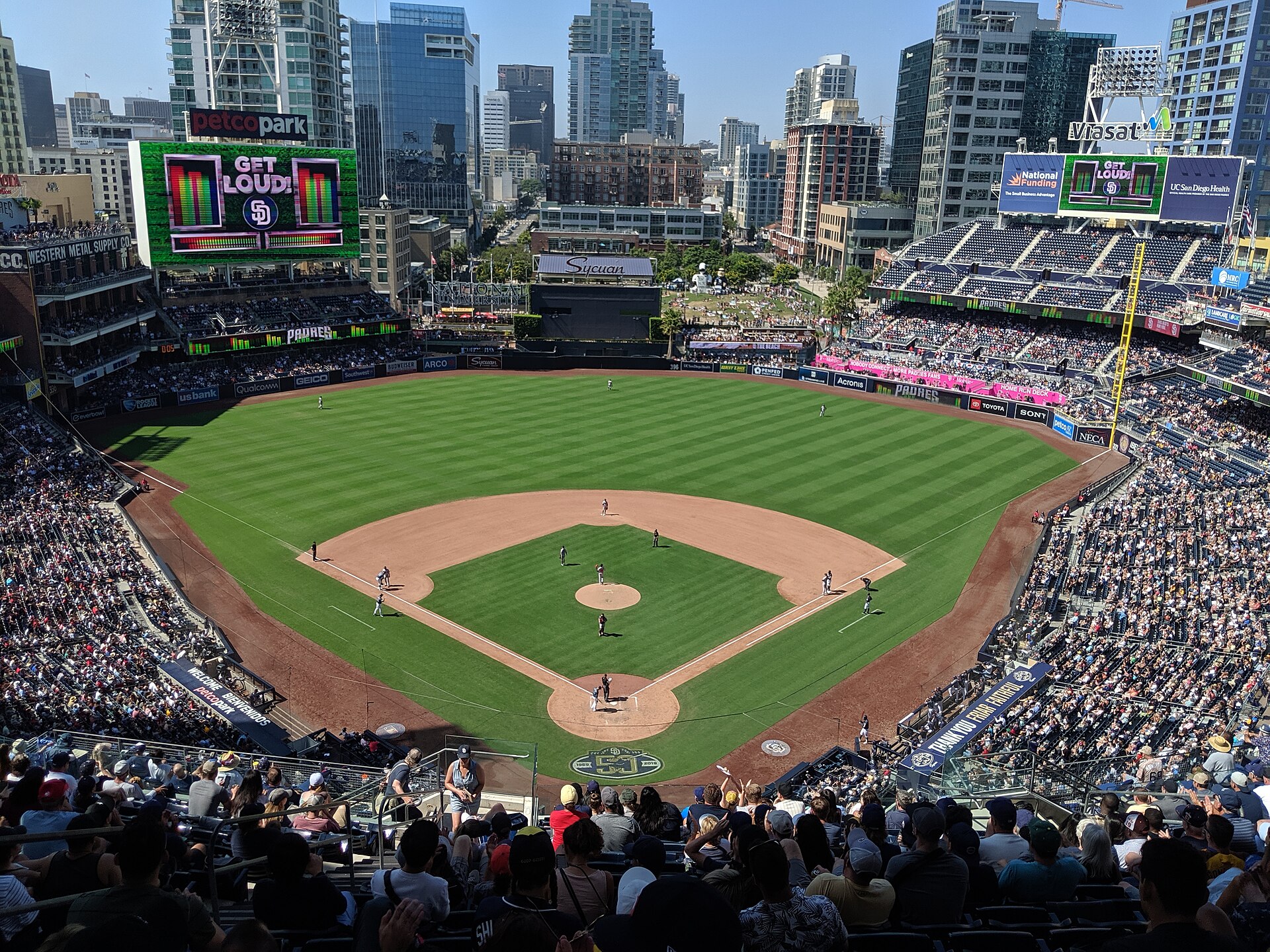 A packed Petco Park during a Padres game, with GET LOUD on the scoreboard