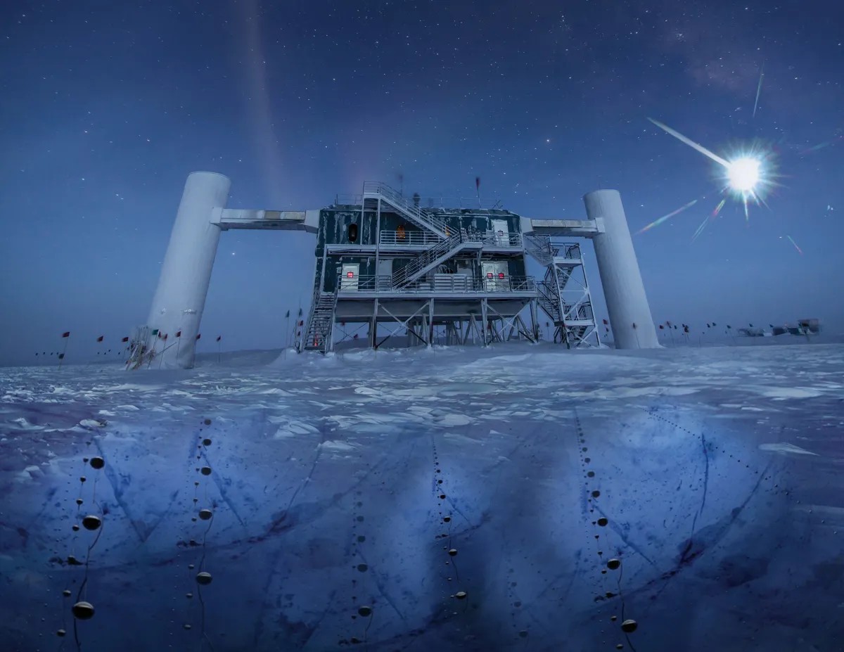 Illustration of the IceCube Laboratory with detector strings beneath the Antarctic ice