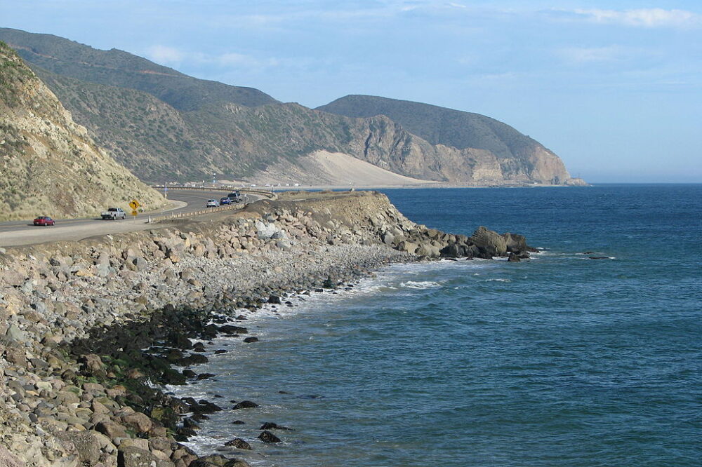 Pacific Coast Highway winding along the Malibu coastline on a clear day