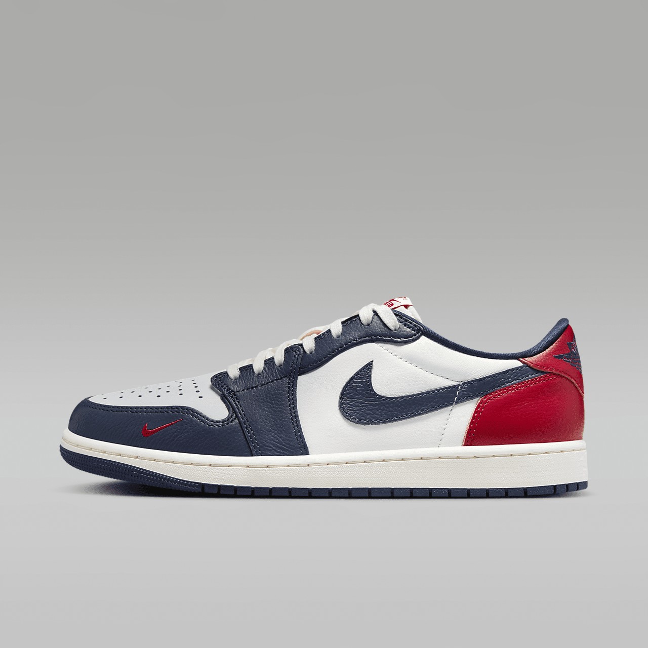 The Air Jordan 1 Low OG Howard University sneaker in white, navy, and red — official product photo