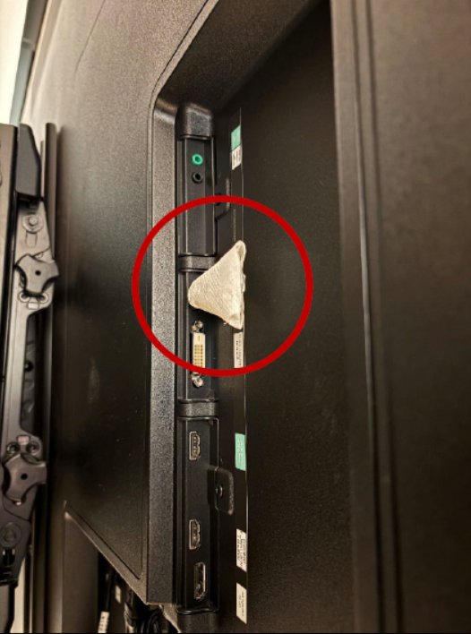 The hidden recording device, circled in red, concealed in toilet paper and plugged into the back of a television in an OpenAI executive conference room