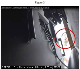 CCTV still from the federal complaint showing a man circled in red looking behind a television in an OpenAI office
