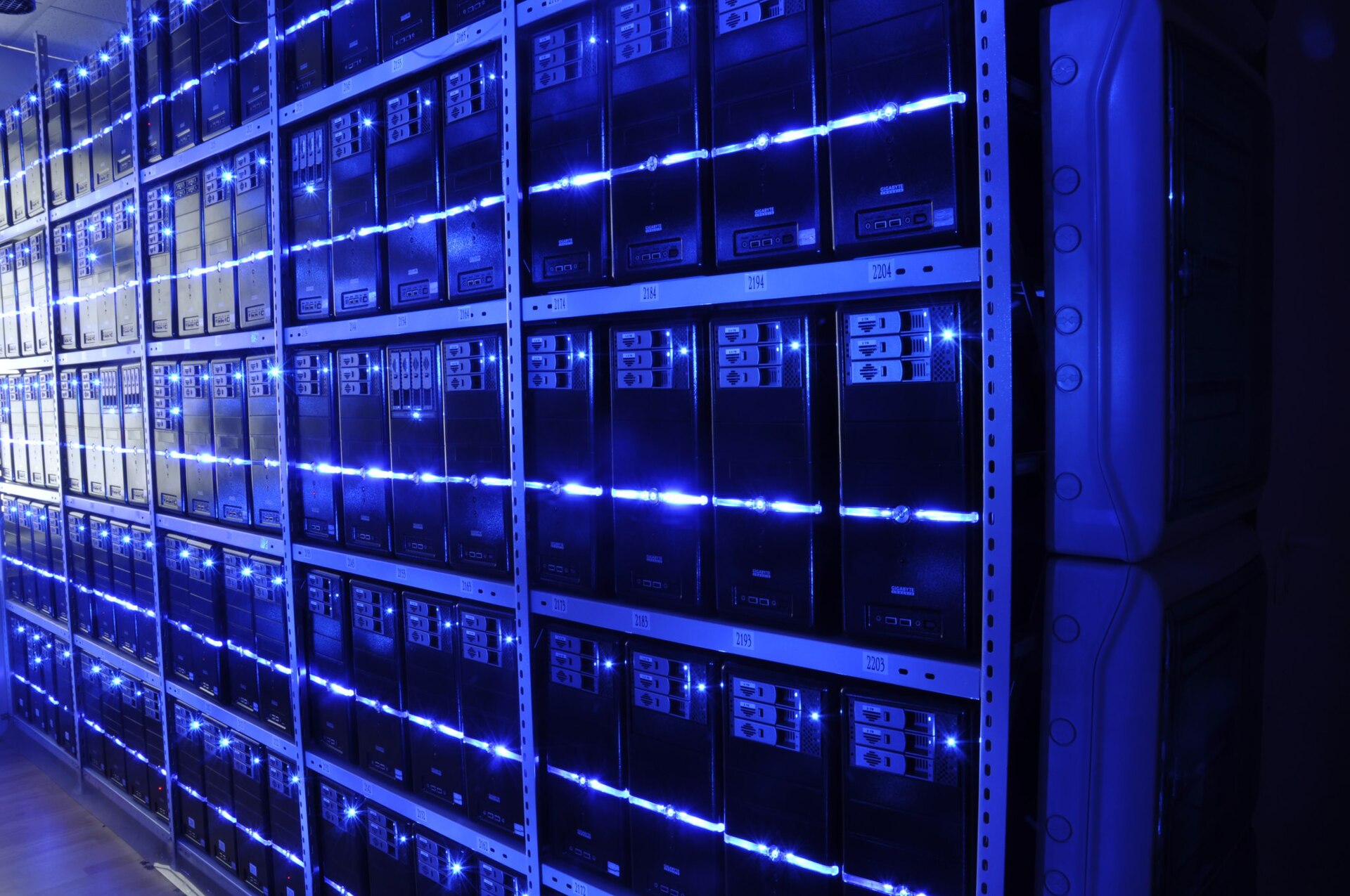 Server racks with blue lighting in a modern data center