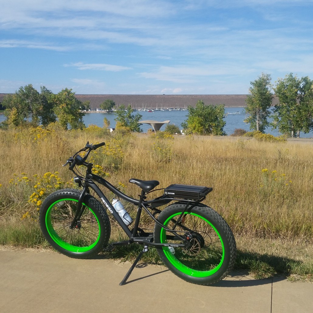 An electric mountain bike on a desert trail in bright daylight