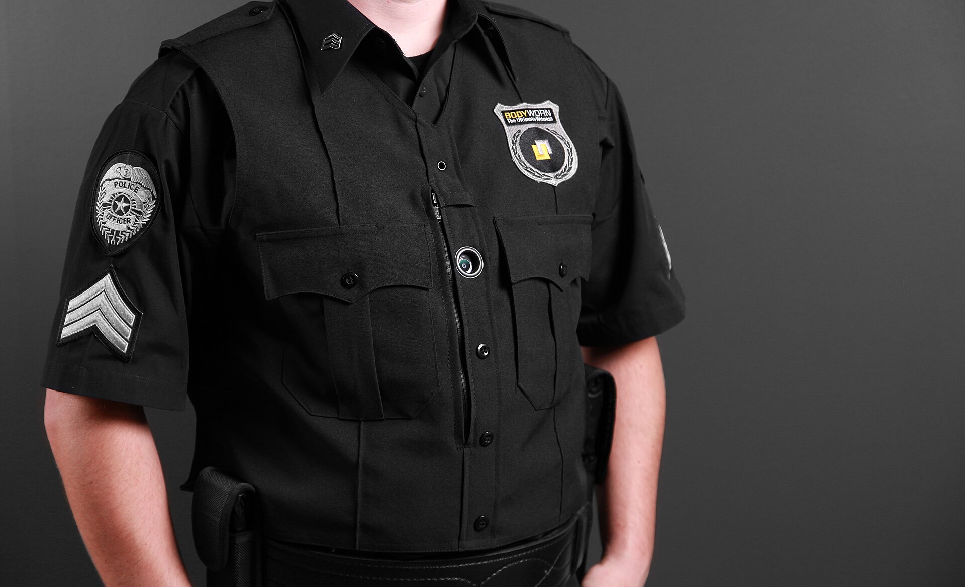 A police officer's uniform with a body-worn camera mounted on the chest
