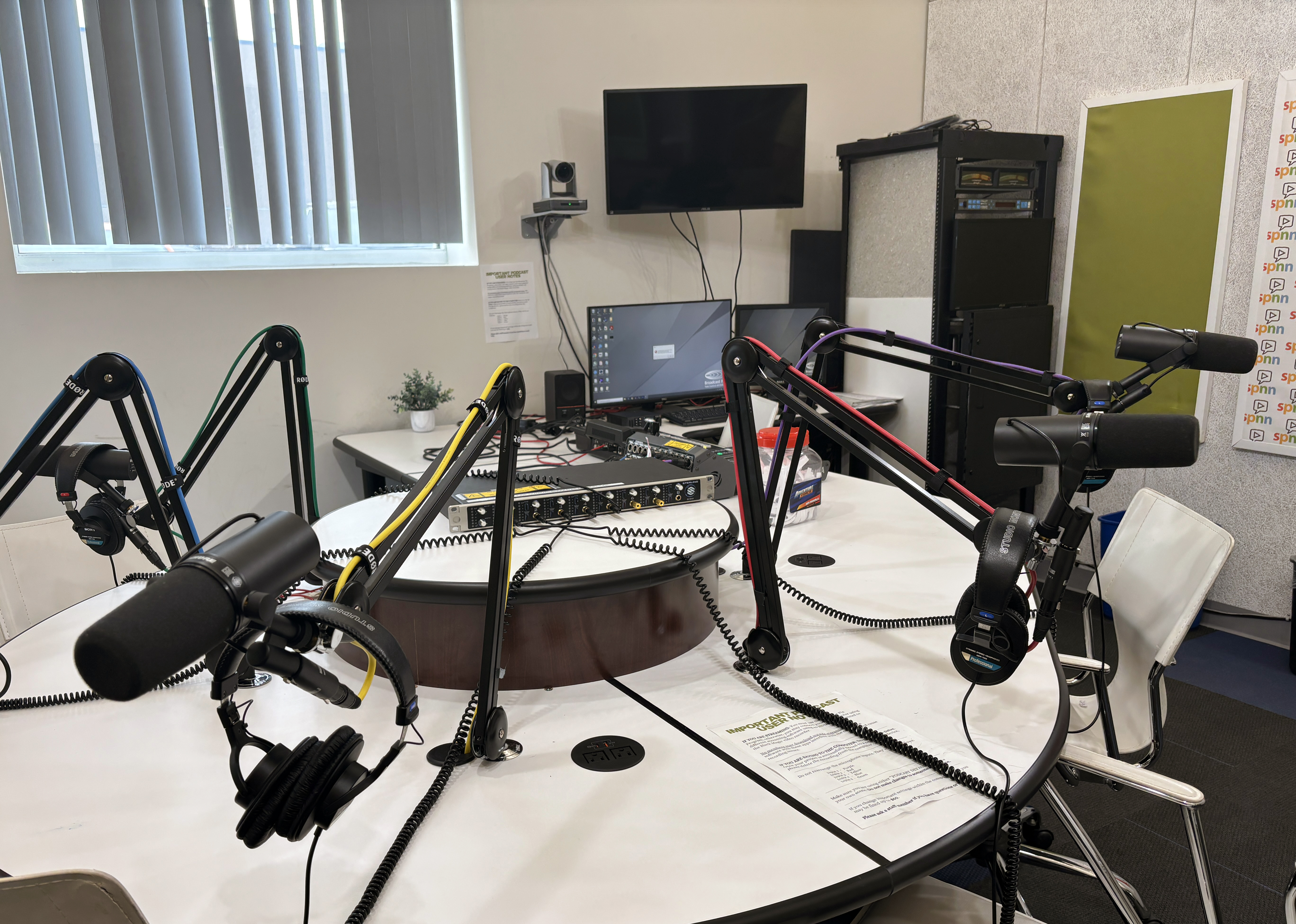 A podcast studio with professional microphones