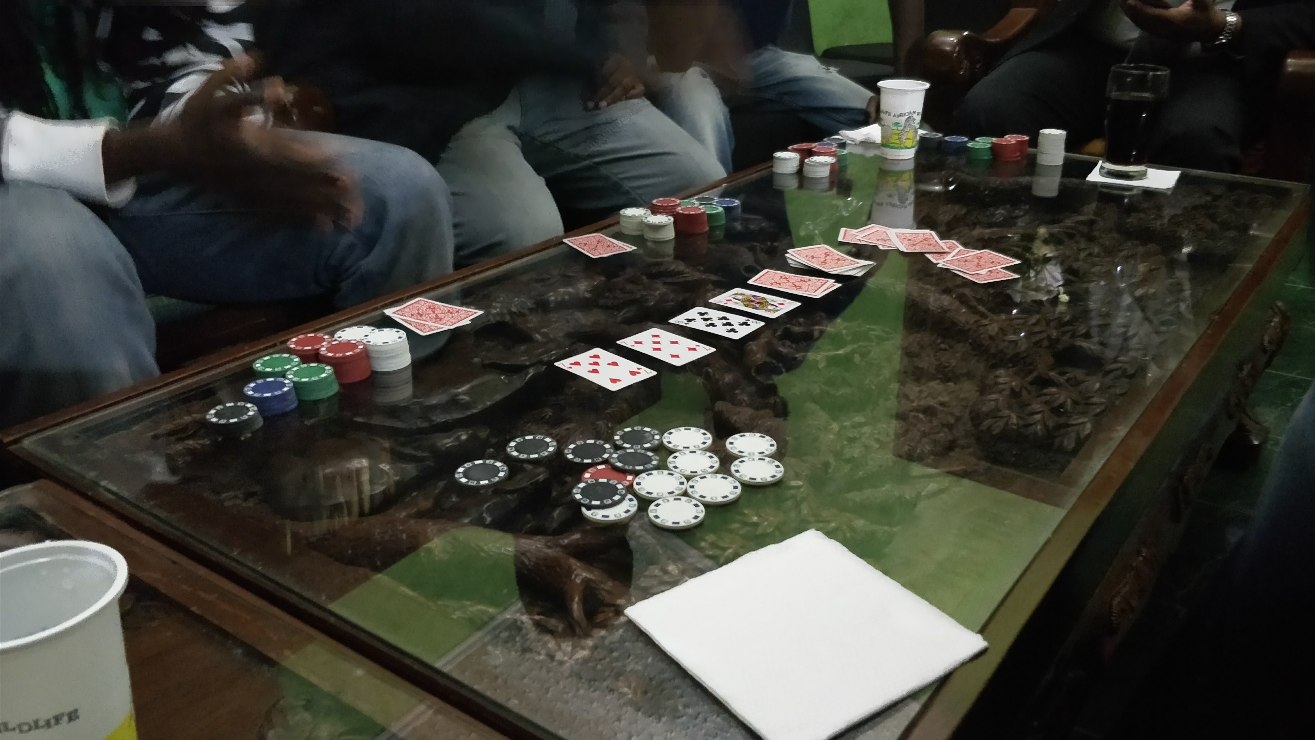 A Texas Hold'em hand in progress, with hole cards and chips on the felt (file photo)