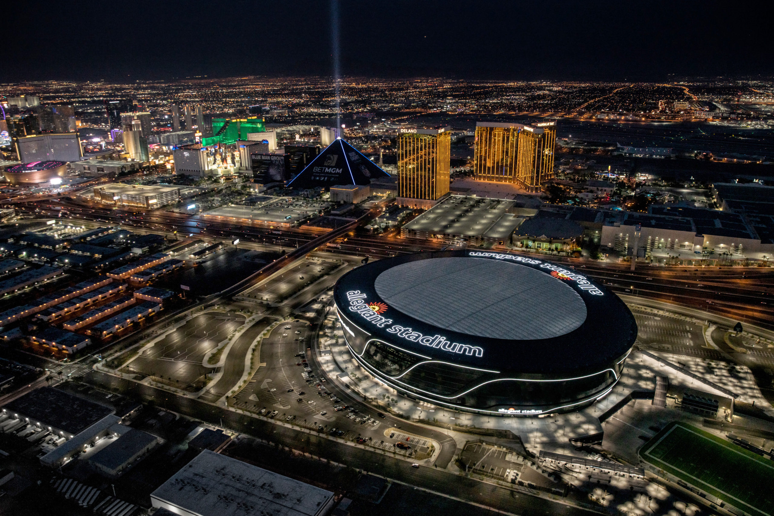Allegiant Stadium at night during a Raiders game