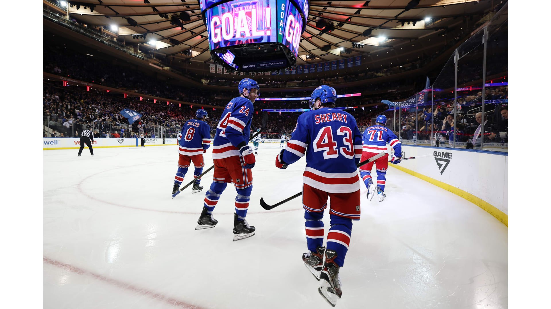 New York Rangers players in action during a home game at Madison Square Garden.