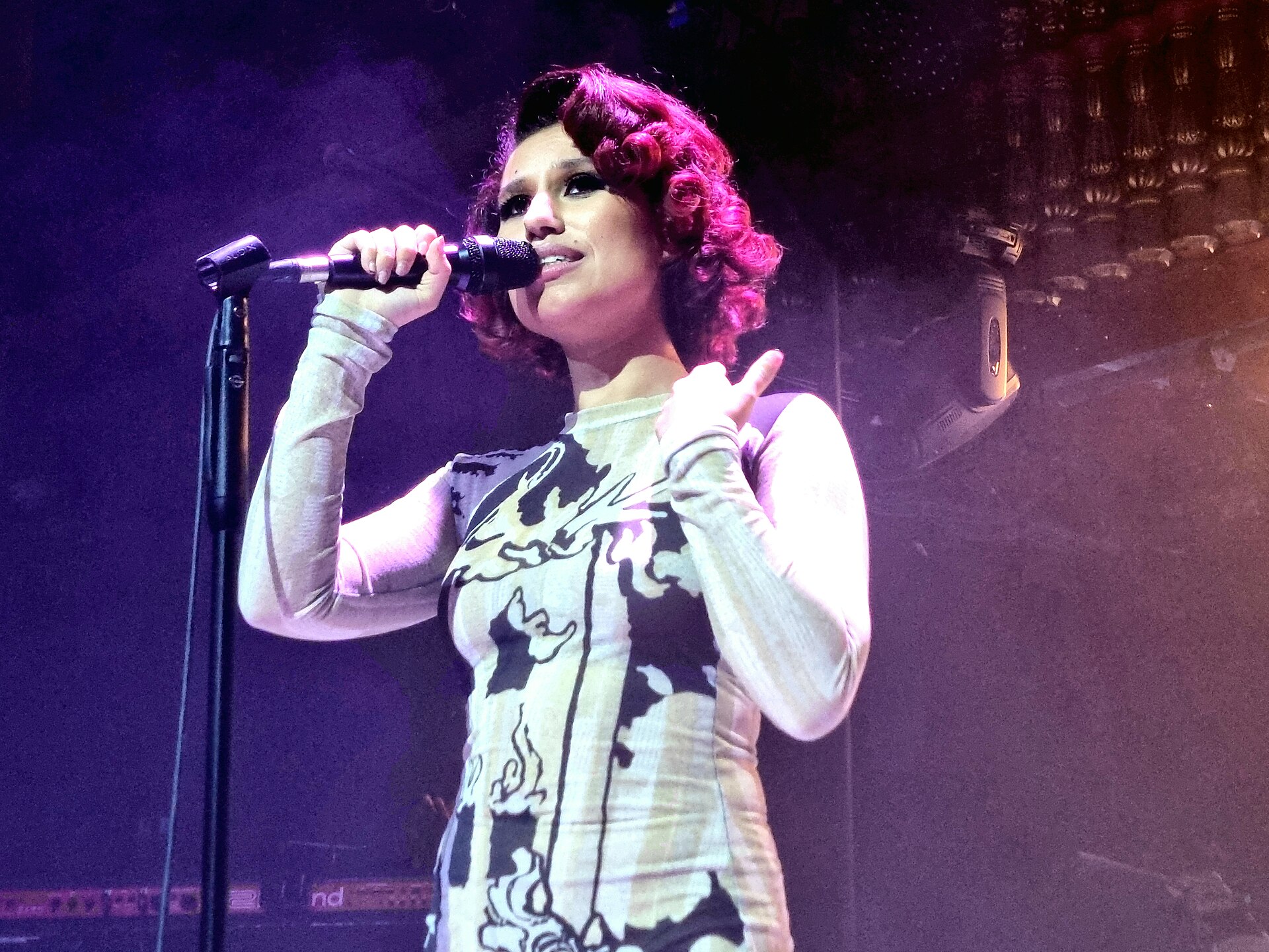 RAYE performing live on stage
