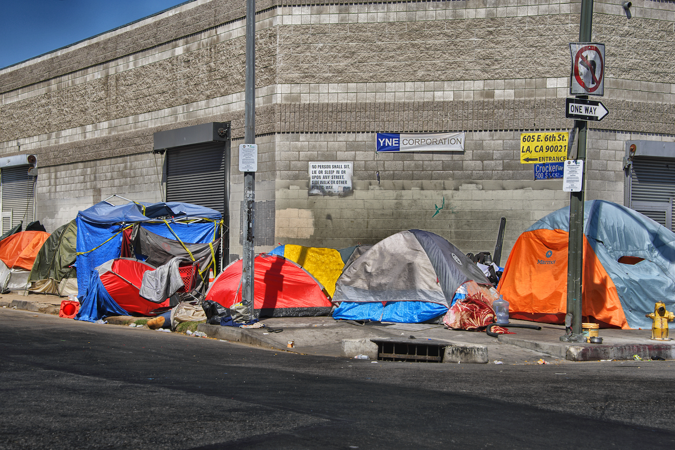 Tents line a street in Los Angeles' Skid Row neighborhood in daylight