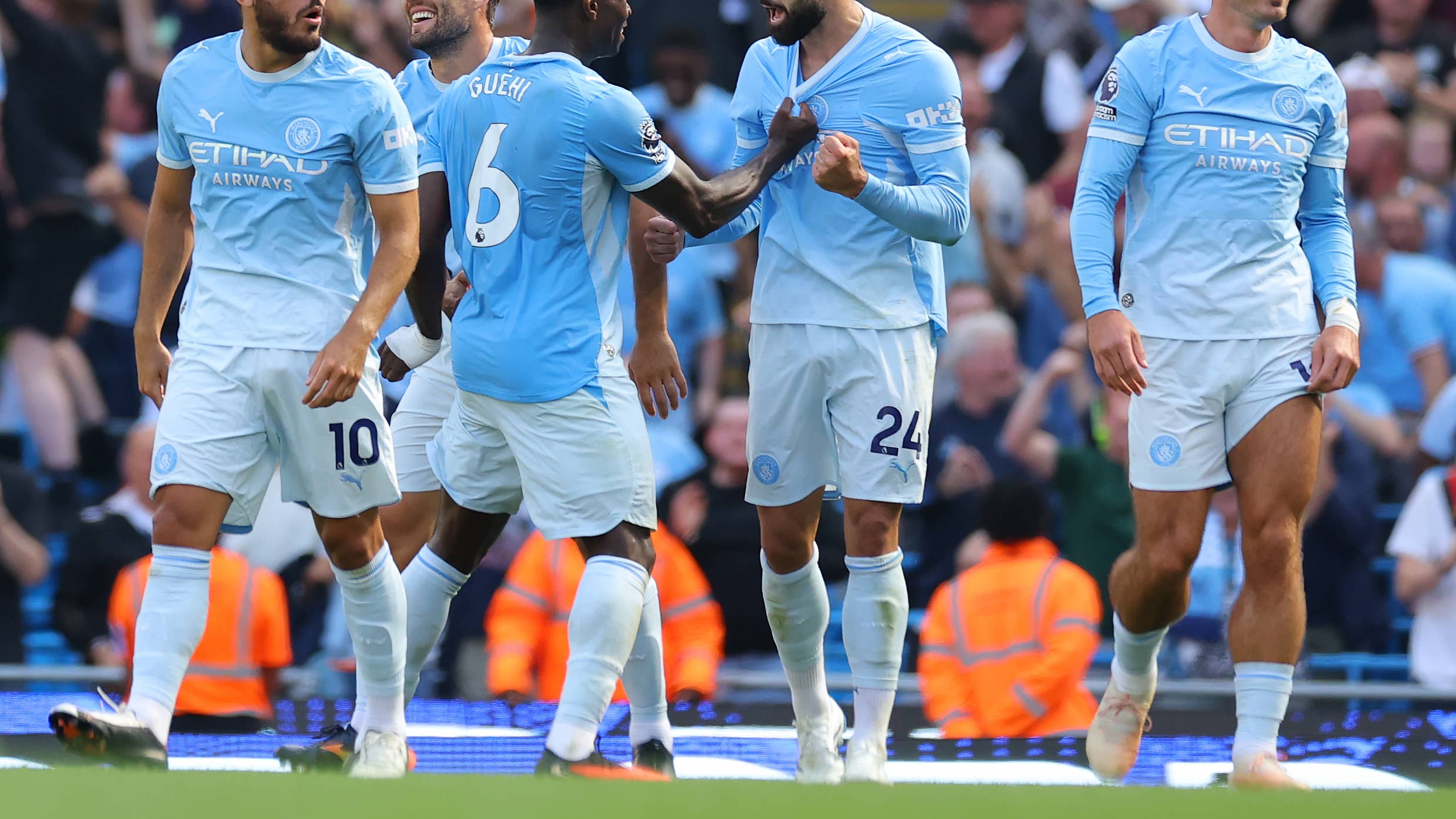 Manchester City players celebrate a goal