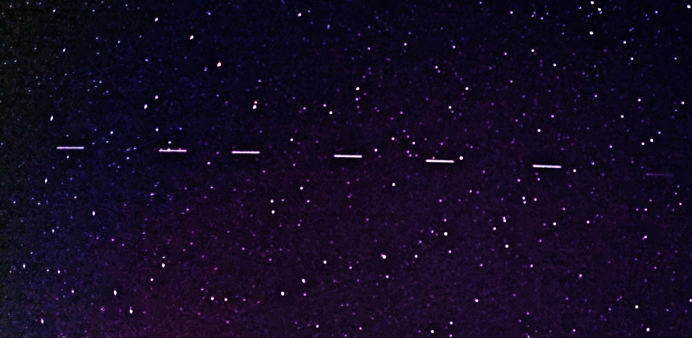 Starlink satellites crossing the night sky — the FCC approved 15,000 more for Starlink Mobile