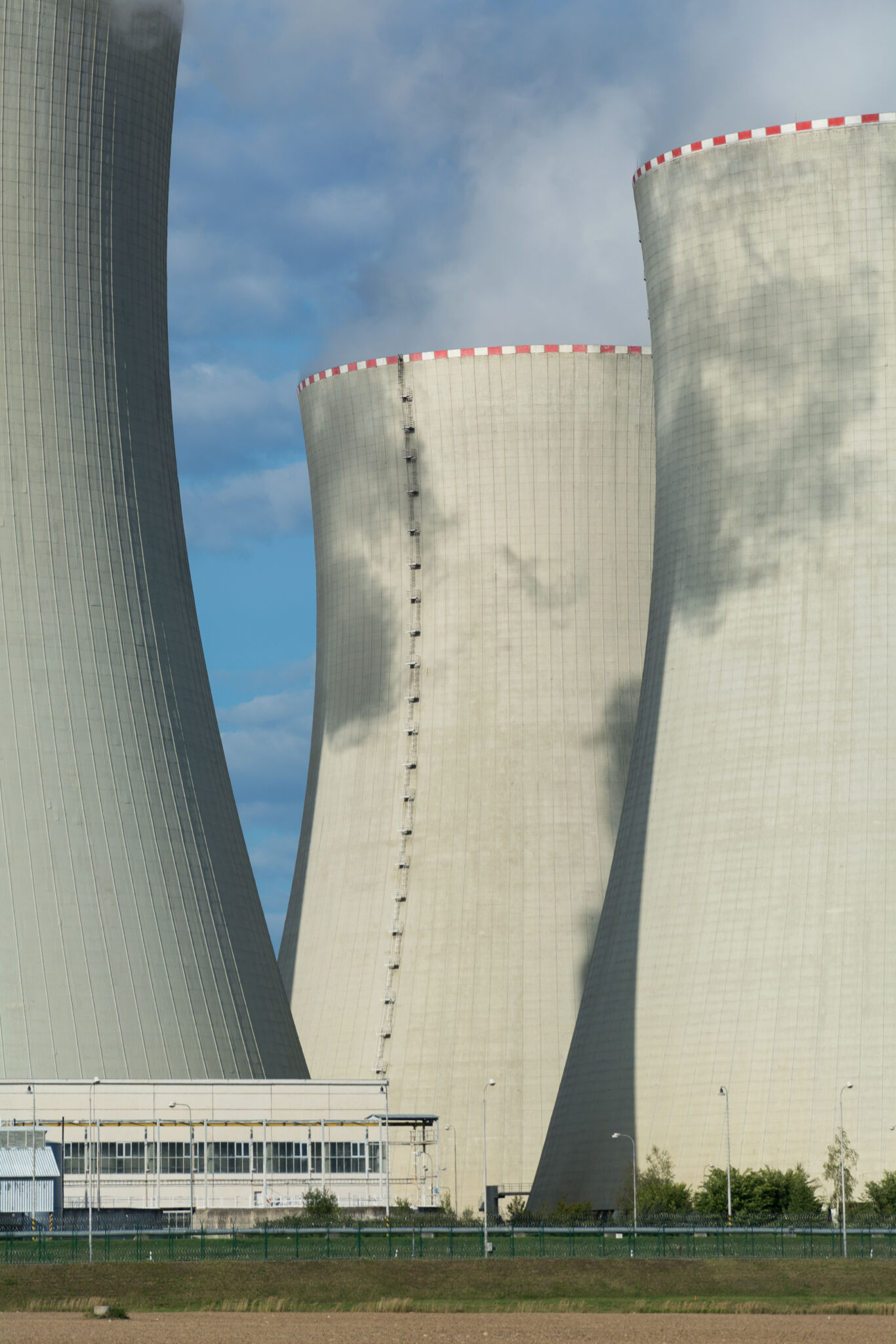 Cooling towers of a nuclear power plant against a blue sky